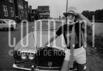 29-06-1976 Elton John in Amsterdam, The Netherlands. June 29, 1976.

[keywords]Black & White Image, Sunglasses, Laughing, Car, Scarf, Hat, Half Length[/keywords]